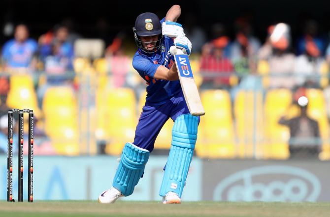 Shubman Gill drives the ball for a boundary.