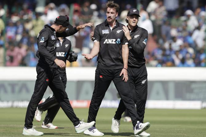 Blair Tickner celebrates the wicket of Rohit Sharma