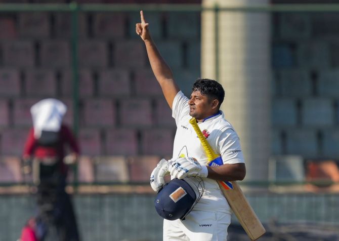 Mumbai's run-machine Sarfaraz Khan gestures to the dressing room after scoring a hundred against Delhi on Day 1 of the Ranji Trophy Group B match, at the Ferozshah Kotla ground in New Delhi, on Tuesday. 