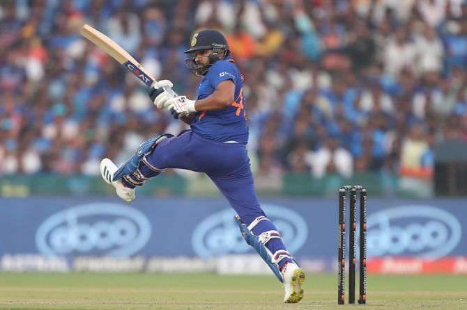 Rohit Sharma pirouettes on one foot to dispatch the ball to the boundary.