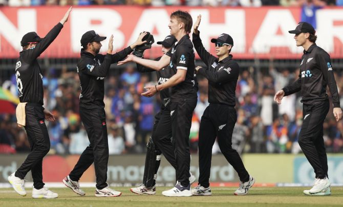 Blair Tickner celebrates with his team-mates after taking the wicket of Shubman Gill.