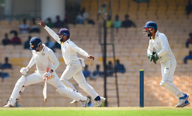 Tamil Nadu's players celebrate after the wicket of Saurashtra's captain Ravindra Jadeja