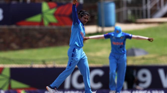 Archana Devi celebrates the wicket of Niamh Holland.