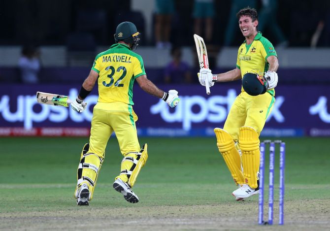 Australian all-rounders Glenn Maxwell and Mitchell Marsh celebrate on scoring the winning runs in the 2021 T20 World Cup final in Dubai