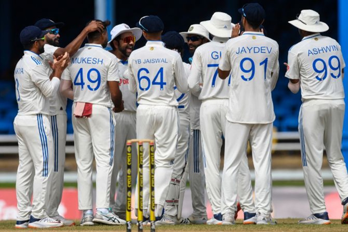 Debutant Mukesh Kumar is congratulated by his India teammates after trapping southpaw Alick Athanaze leg before with an in-swinger in the first over of the day.