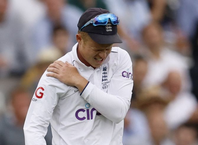 England's Ollie Pope walks off for medical attention after injuring his shoulder while fielding on Day 1 of the 2nd Ashes Test at Lord's in London on Wednesday, June 28