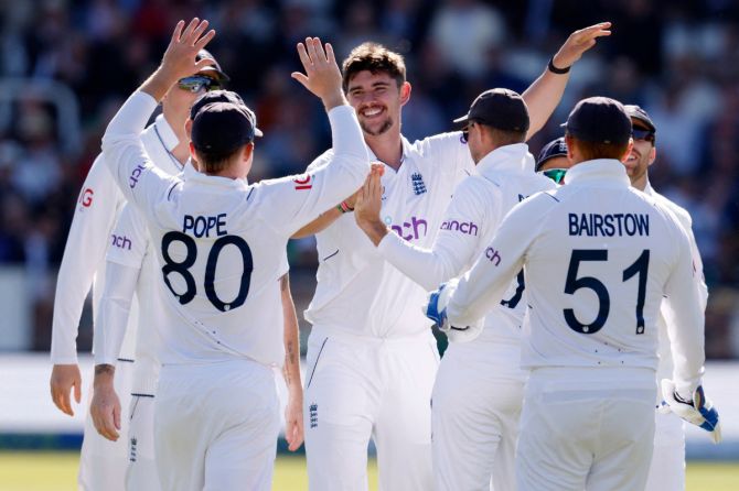 England's Josh Tongue celebrates with teammates after taking the wicket of Ireland's Andy Balbirnie 