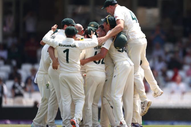 Australia players celebrate the wicket of Mohammed Siraj to dismiss India for 234 and win the WTC final by 209 runs on Sunday