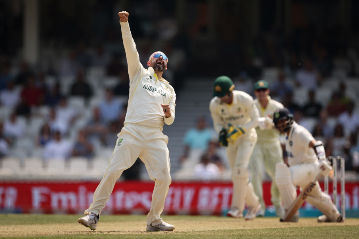 Nathan Lyon celebrates after taking the wicket of Shardul Thakur 