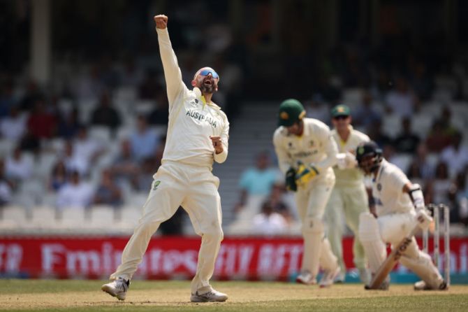 Nathan Lyon celebrates after taking the wicket of Shardul Thakur