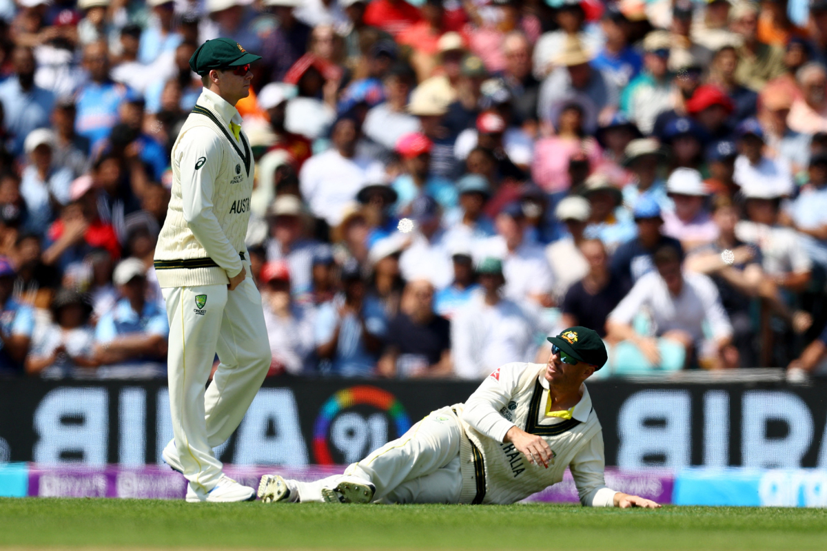 Australia's David Warner reacts after putting down Ajinkya Rahane 