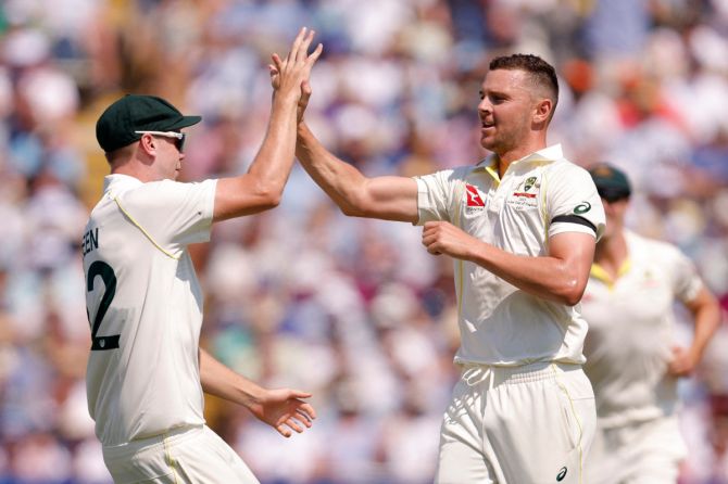 Australia's Josh Hazlewood celebrates taking the wicket of England's Ben Duckett, caught by wicket-keeper Alex Carey