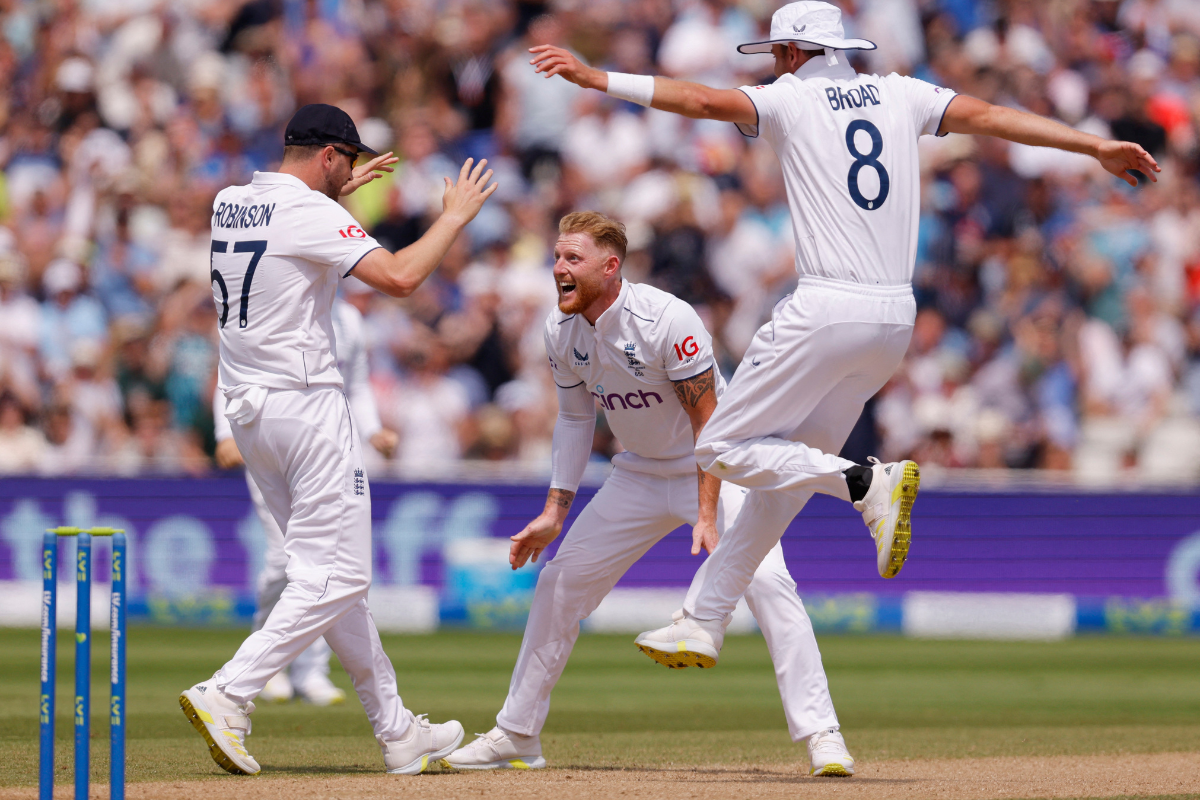 England's Ben Stokes celebrates with Ollie Robinson and Stuart Broad after taking the wicket of Australia's Steven Smith
