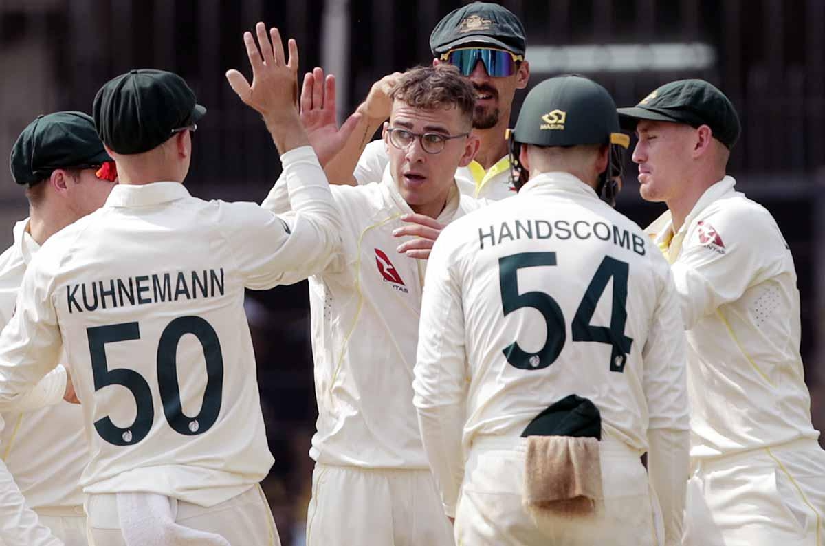 Todd Murphy celebrates with his team-mates after taking the wicket of Virat Kohli