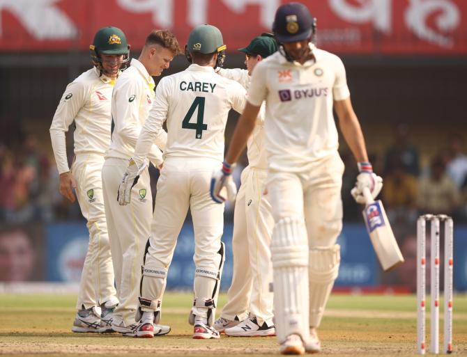 Matthew Kuhnemann celebrates the wicket of Shubman Gill