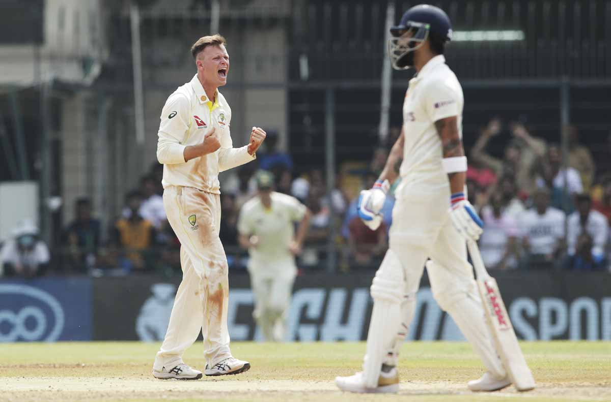 Matthew Kuhnemann celebrates the wicket of Virat Kohli.