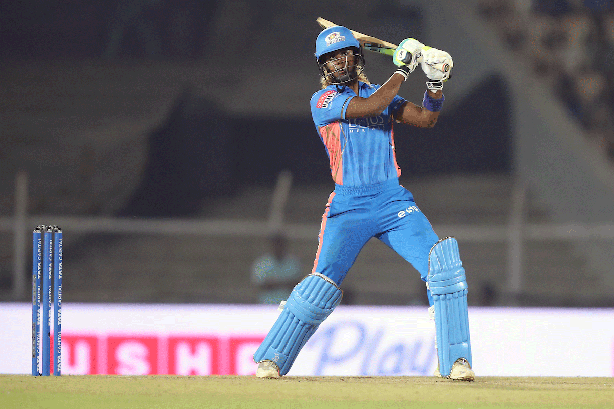 Mumbai Indians' Hayley Matthews goes over the top during her match-winning innings of 77.