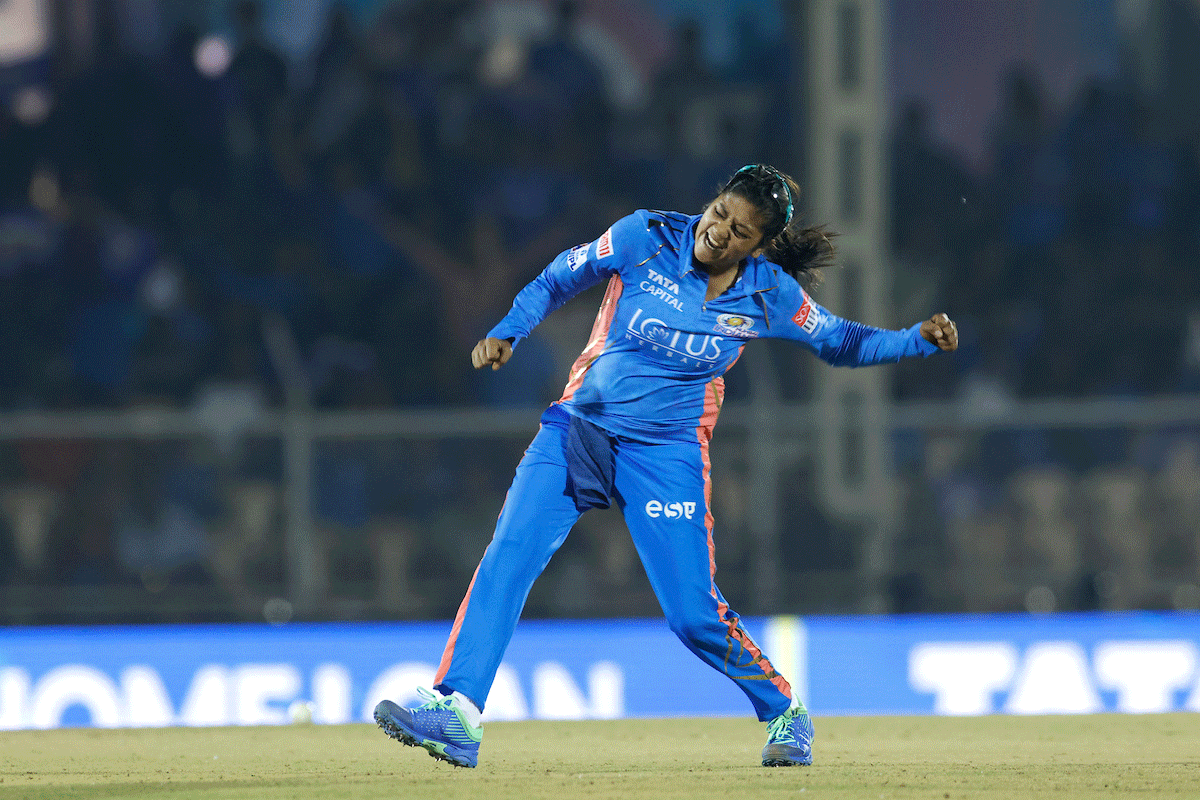 Mumbai Indians' Saika Ishaque celebrates the wicket of Royal Challengers Bangalore's Disha Kasat