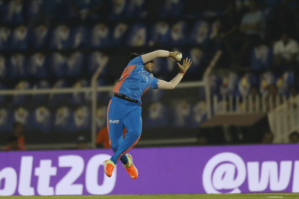 Mumbai Indians' Jintimani Kalita takes the blinder to dismiss Gujarat Giants' Ashleigh Gardner