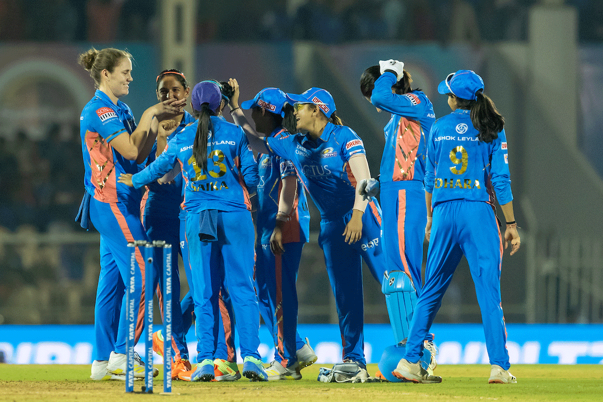 Mumbai Indians' Natalie Sciver celebrates the wicket of Gujarat Giants' Sneh Rana