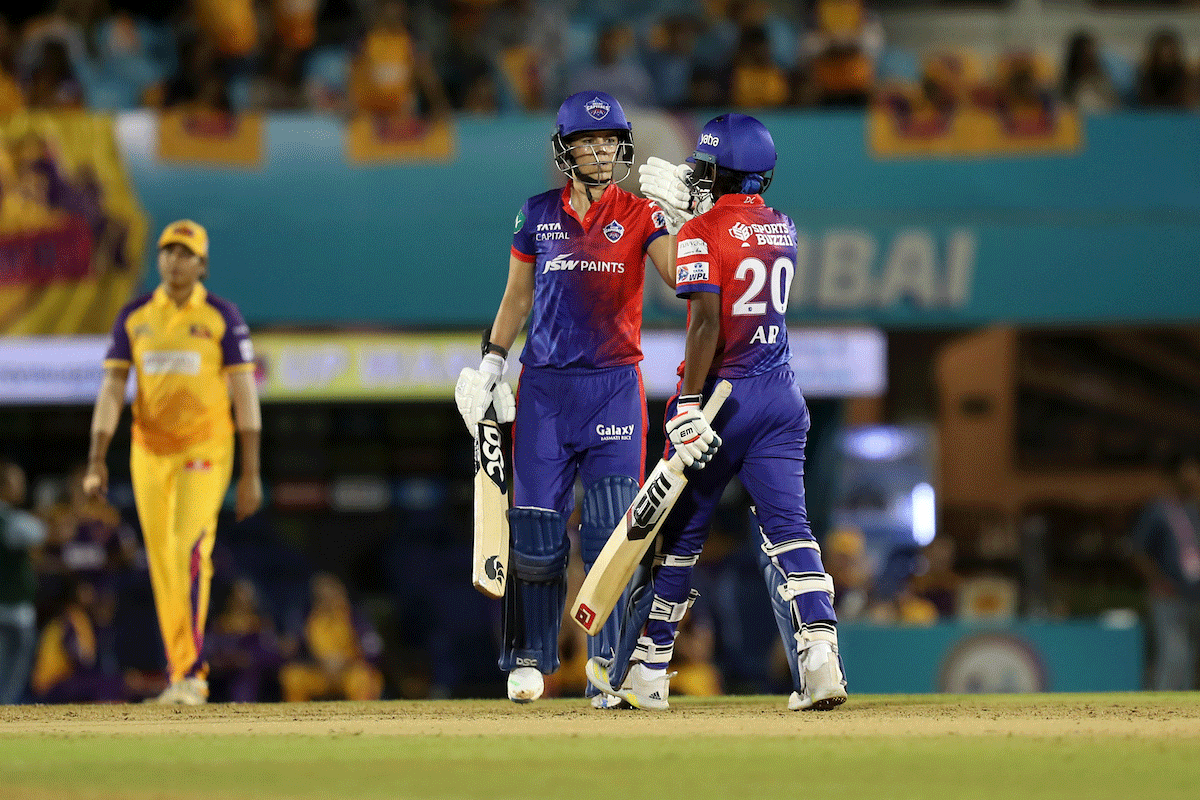 DC's Marizanne Kapp and Arundhati Reddy celebrate on scoring the winning runs