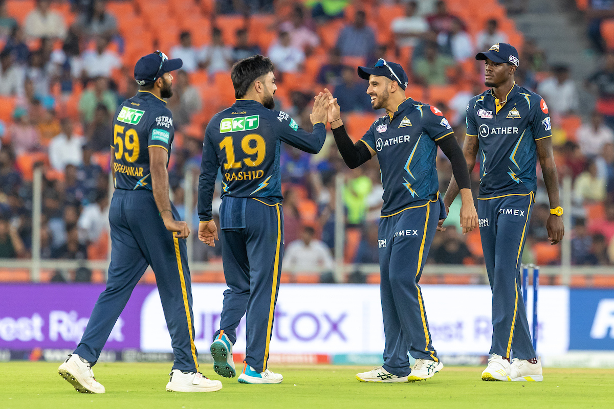 Gujarat Titans players celebrate the wicket of Quinton De Kock