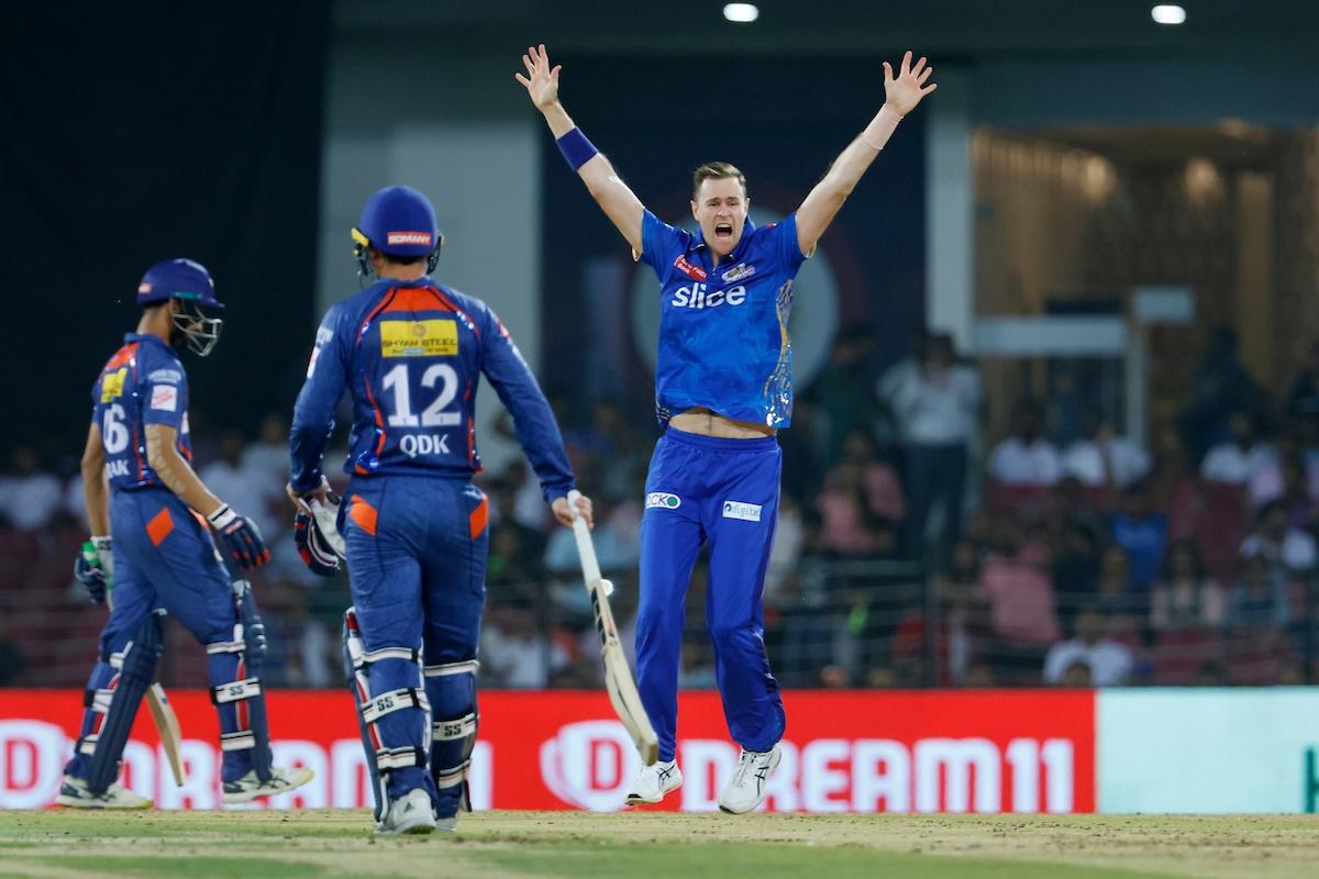 Piyush celebrates with teammates after dismissing Quinton de Kock