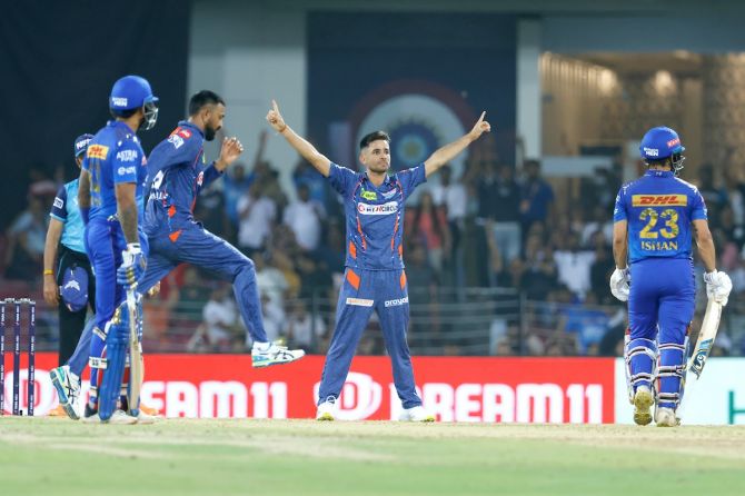 Ravi Bishnoi celebrates the wicket of Ishan Kishan