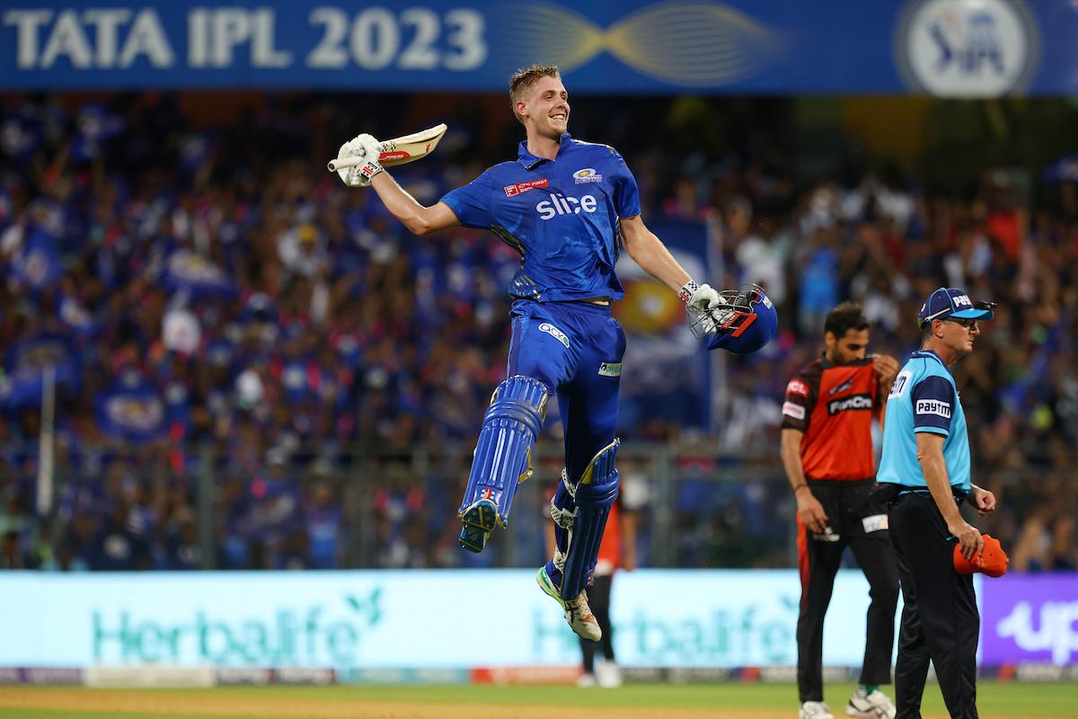 Mumbai Indians all-rounder Cameron Green celebrates scoring a hundred during the IPL match against Sunrisers Hyderabad, at the Wankhede stadium, in Mumbai, on Sunday.