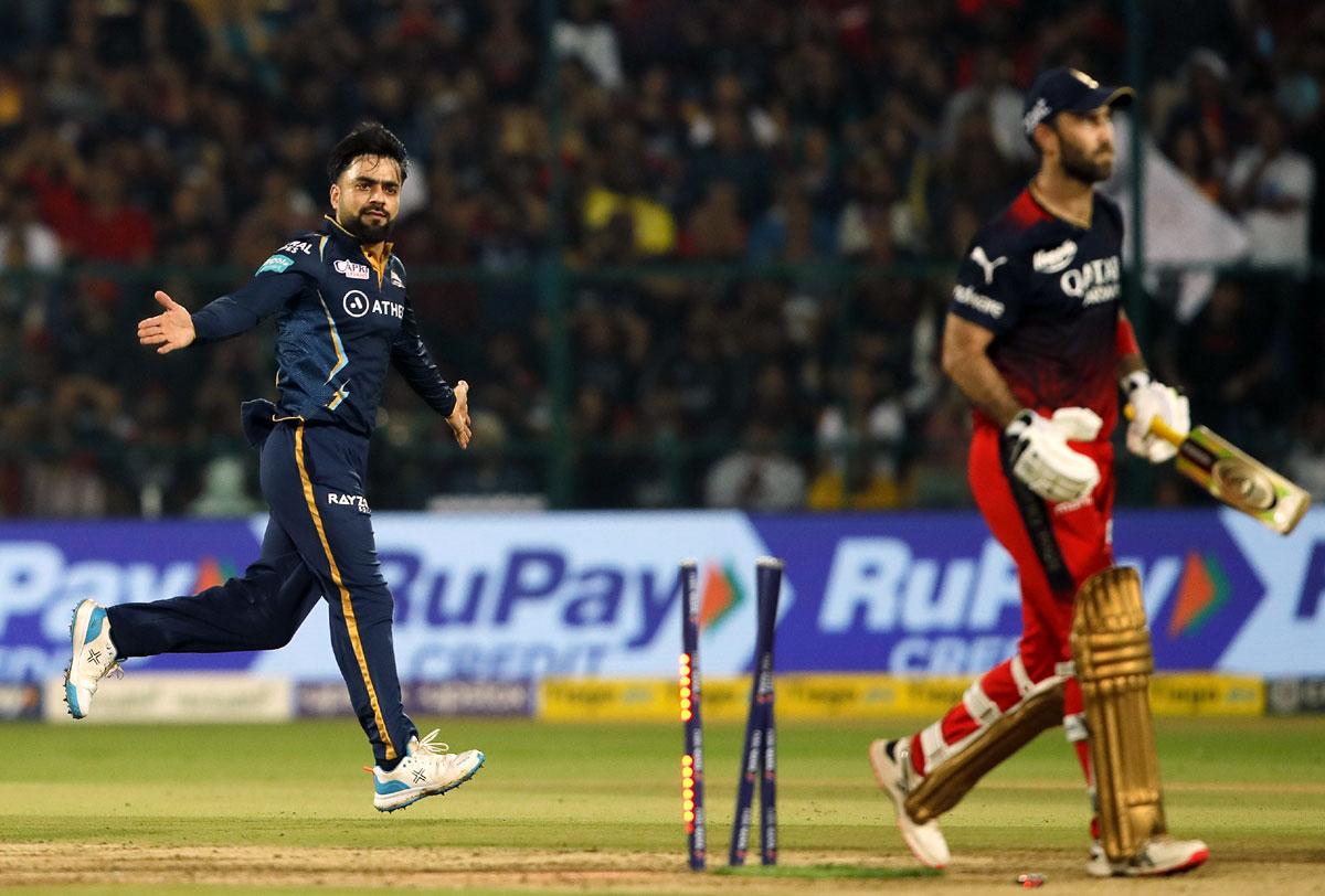 Rashid Khan celebrates the wicket of Glenn Maxwell.