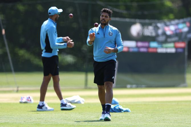 Umesh Yadav seen with Axar Patel practice at a nets session on Monday