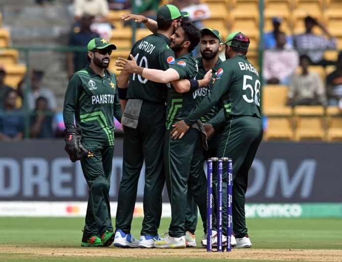 Hasan Ali celebrates with his Pakistan teammates after dismissing New Zealand's Devon Conway during the ICC World Cup match in Bengaluru on Saturday.