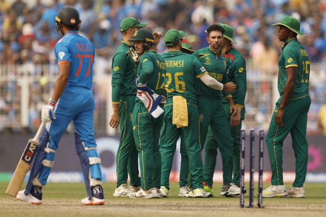 Keshav Maharaj celebrates with his South Africa teammates after dismissing Shubman Gill.