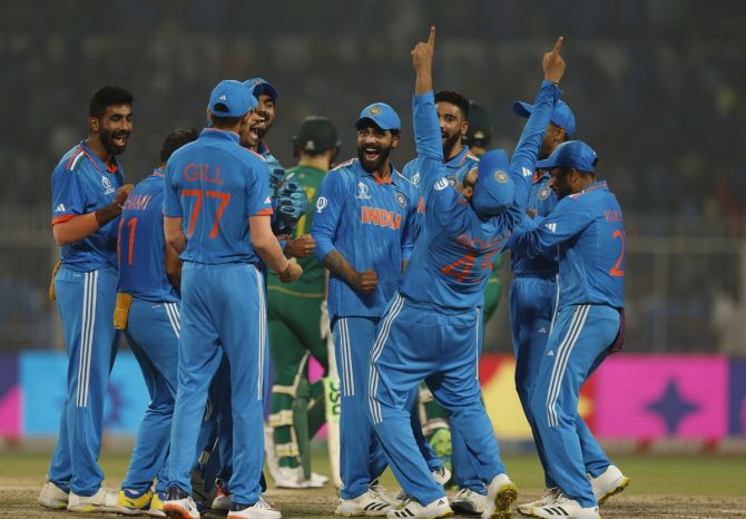 Mohammed Shami celebrates with teammates after taking the lbw wicket of Rassie van der Dussen, following a successful DRS review