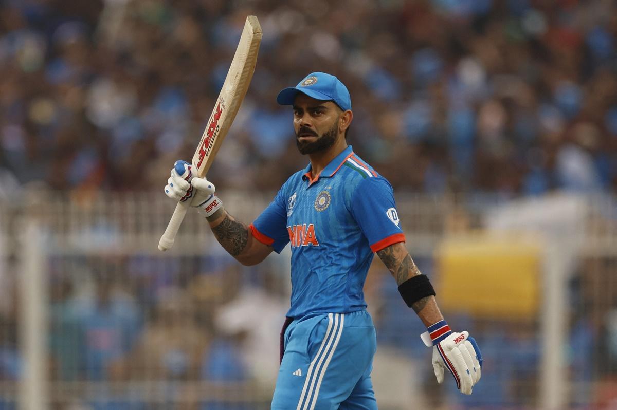 Virat Kohli waves to the Eden Gardens crowd after getting to 50.