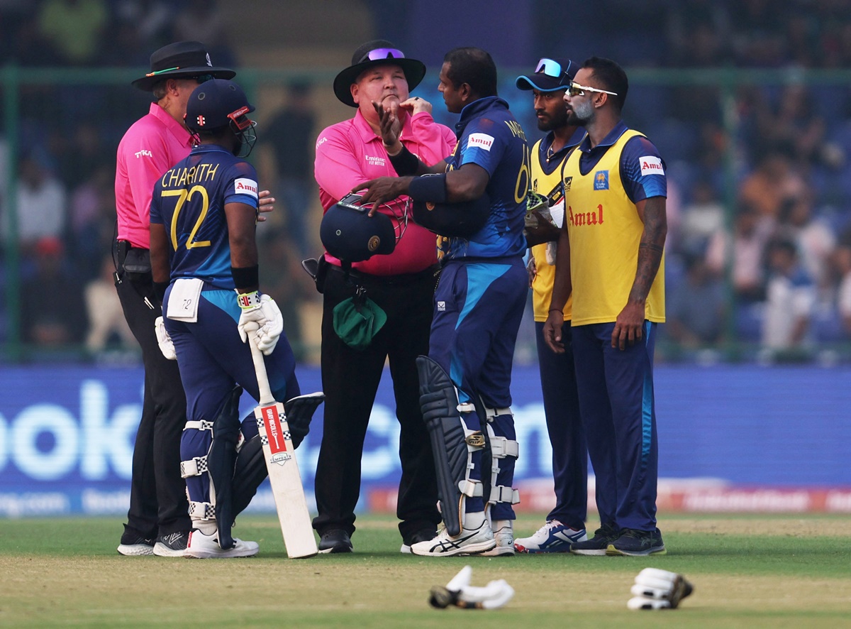 Sri Lanka's Angelo Mathews in animated discussion with umpires Marais Erasmus and Richard Illingworth after being 'timed out' during the ICC World Cup match against Bangladesh in New Delhi on Monday