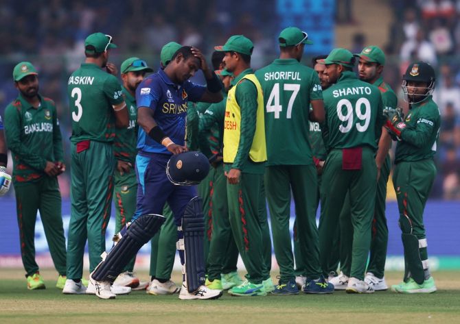 Sri Lanka's Angelo Mathews walks back after being ruled 'timed out' during the ICC World Cup match against Bangladesh in New Delhi on Monday 