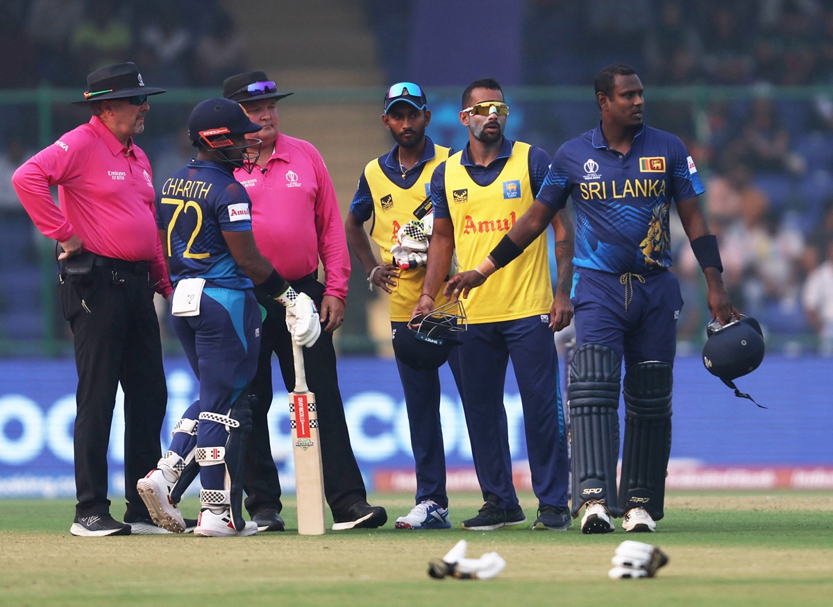 Umpires Marais Erasmus and Richard Illingworth watch as Sri Lanka's Angelo Mathews walks back without facing a ball in the ICC World Cup match against Bangladesh in New Delhi on Monday.