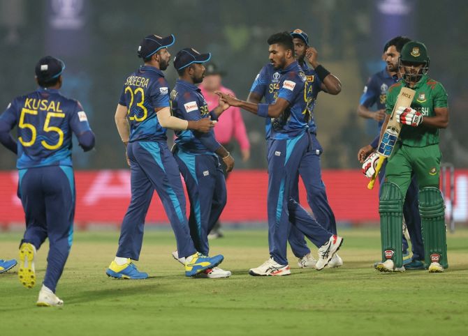 Sri Lanka's Dilshan Madushanka celebrates with teammates after taking the wicket of Bangladesh's Tanzid Hasan
