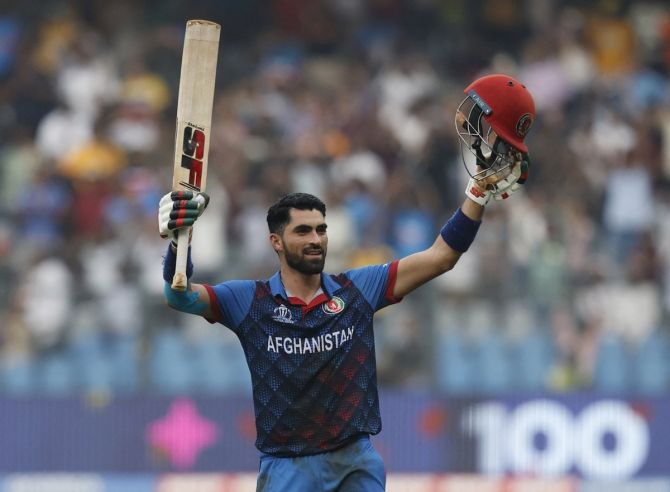 Ibrahim Zadran celebrates after completing his hundred in the ICC World Cup match against Australia in MUmbai on Tuesday.