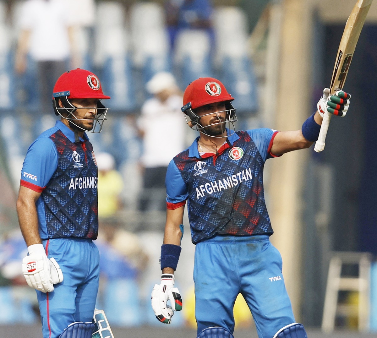 Ibrahim Zadran waves to the Afghanistan dressing room after his 50.