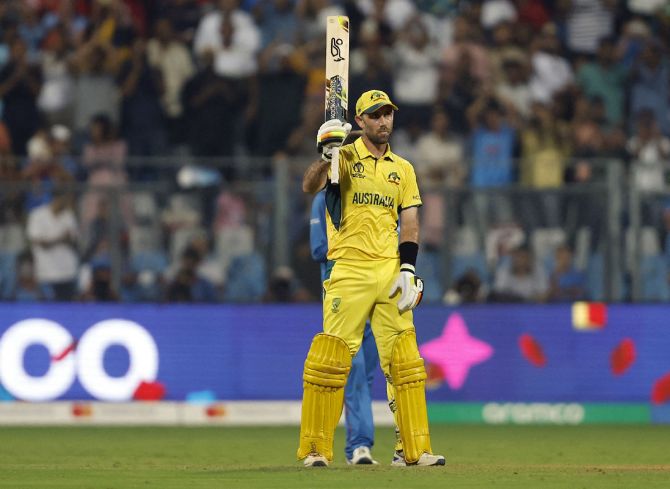 Glenn Maxwell celebrates after completing his century