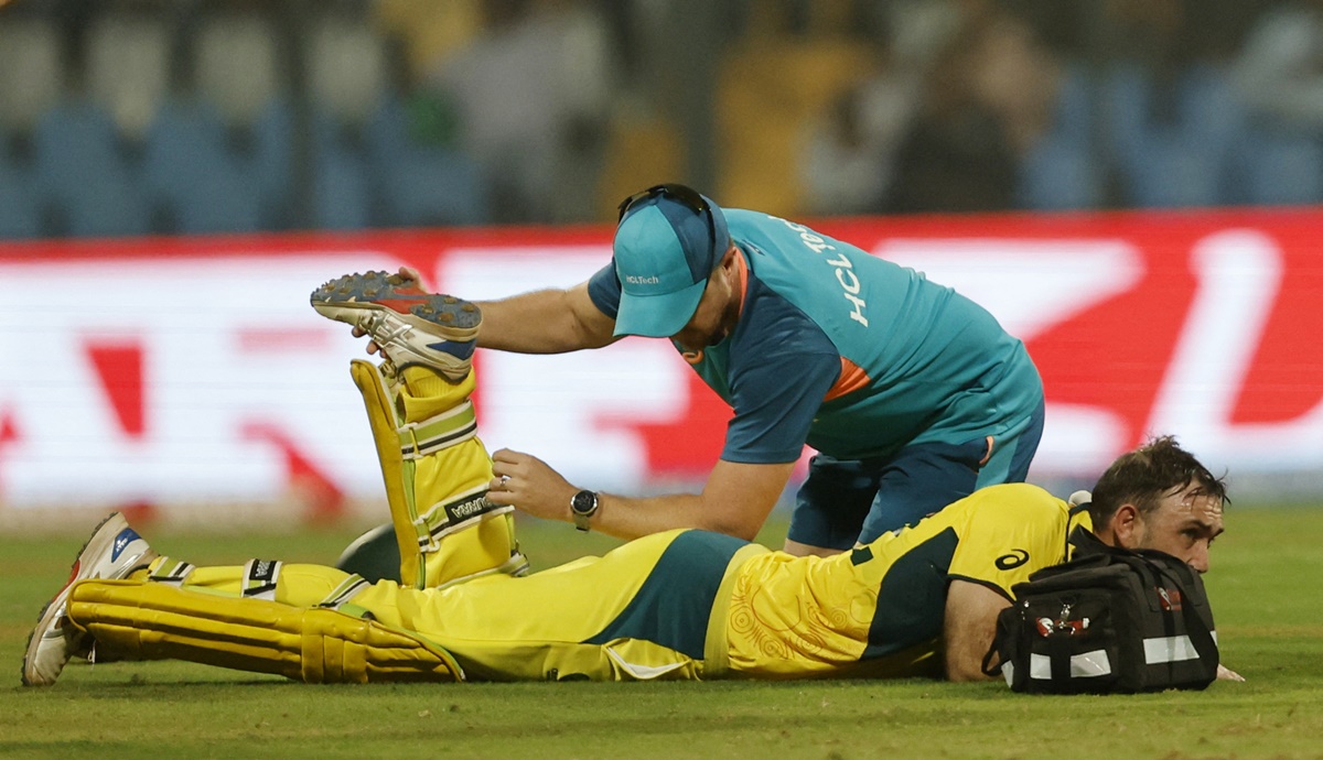Glenn Maxwell receives medical attention after suffering a bout of cramps.