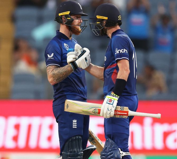 England's Ben Stokes celebrates scoring a hundred with Chris Woakes during the ICC World Cup match against the Netherlands at the MCA stadium, in Pune, on Wednesday.