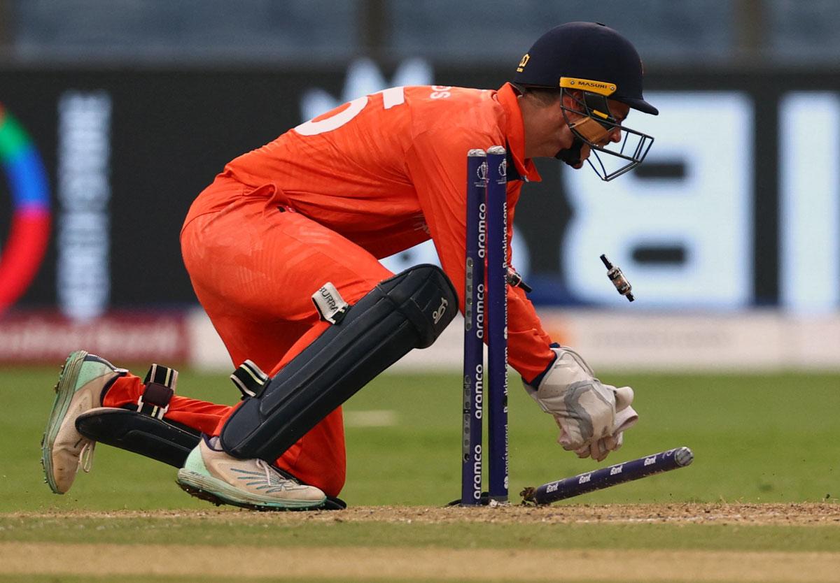 Netherlands wicketkeeper Scott Edwards runs out Dawid Malan