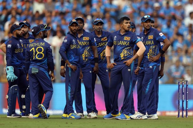 Sri Lanka's players wait for the review against India's Suryakumar Yadav during the ICC World Cup match at the Wankhede Stadium, in Mumbai, on November 2, 2023.