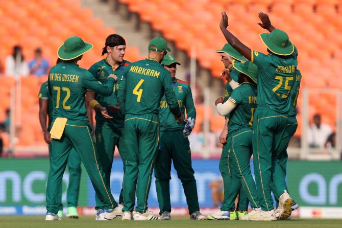 Gerald Coetzee and teammates celebrate taking the wicket of Ikram Alikhil