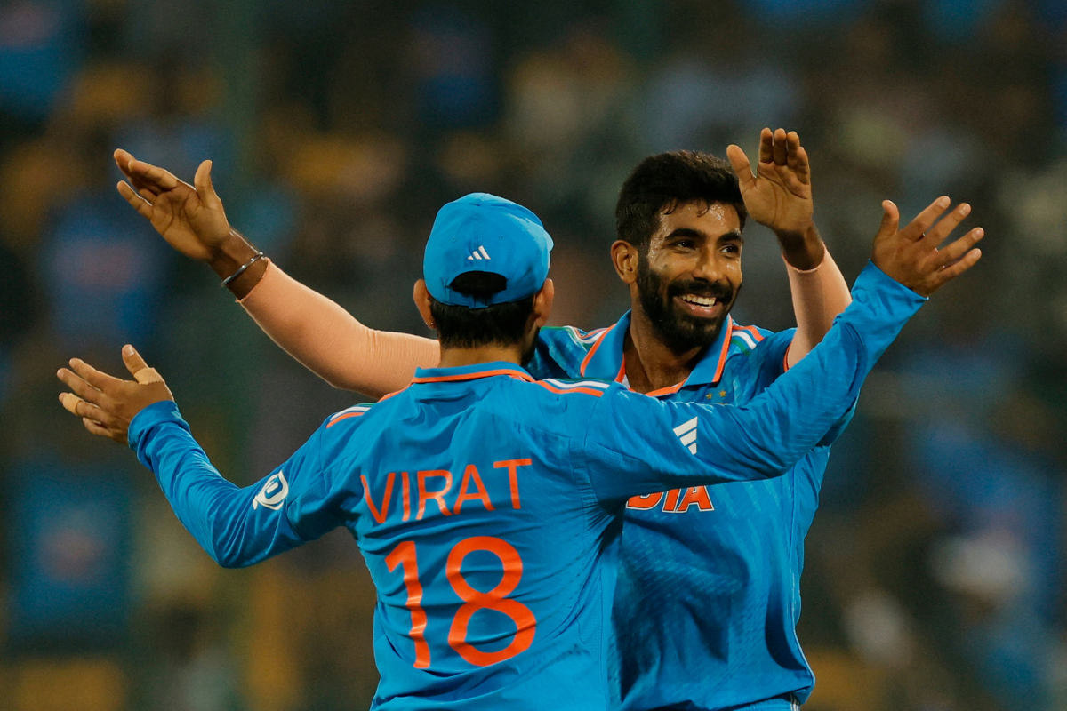 India's Jasprit Bumrah celebrates with Virat Kohli after taking the wicket of Netherlands' Bas de Leede