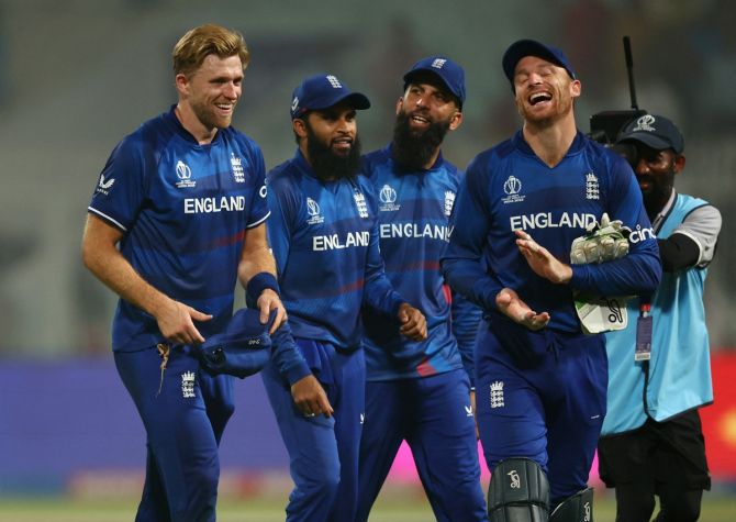 England's David Willey celebrates with Adil Rashid, Jos Buttler and Moeen Ali after victory over Pakistan in the ICC World Cup match at Eden Gardens, Kolkata, on Saturday.