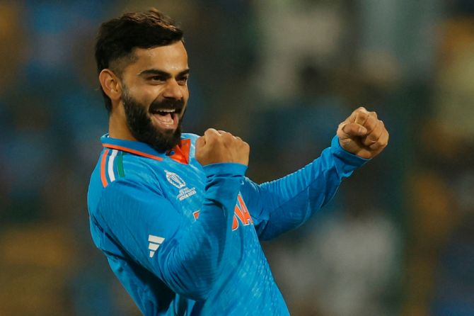 India's Virat Kohli celebrates after taking the wicket of Netherlands' Scott Edwards 